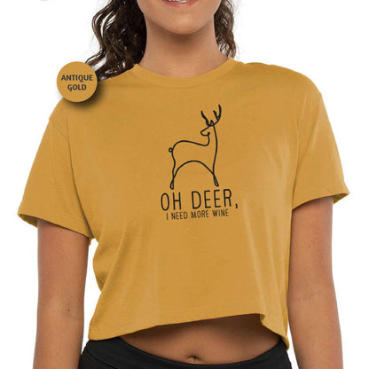 a woman wearing a crop top with a deer on it