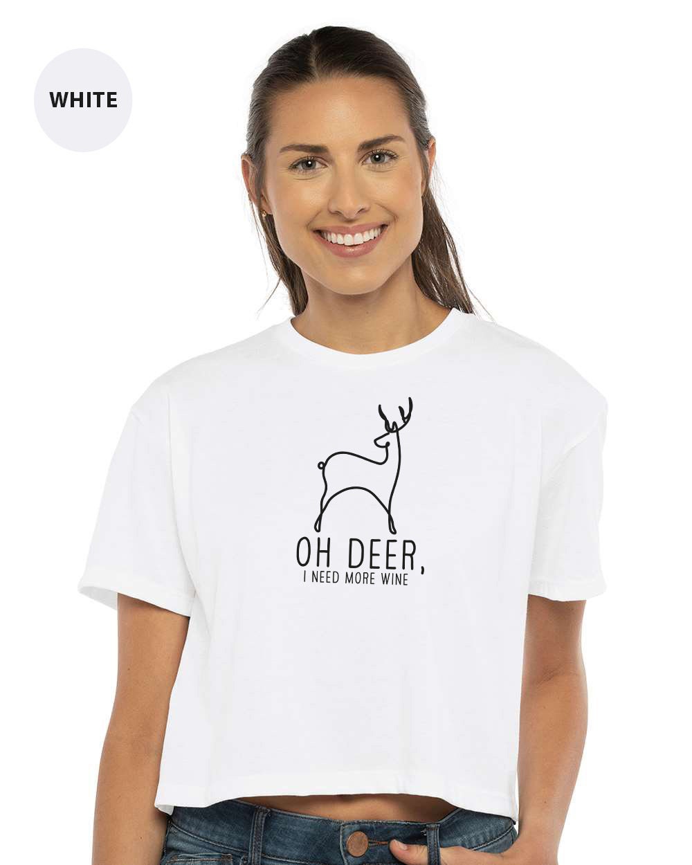 a woman wearing a white crop top with a deer on it