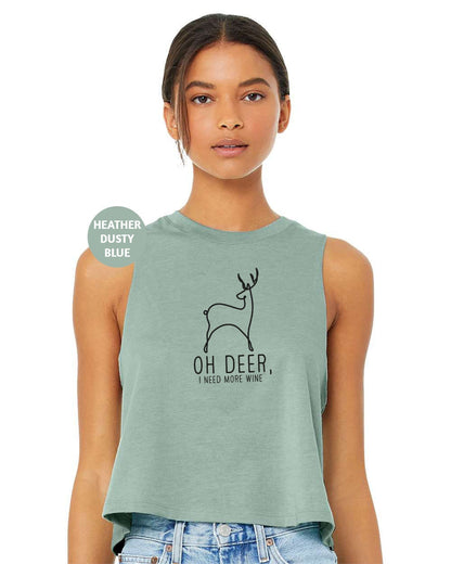 a woman wearing a green tank top with a deer on it