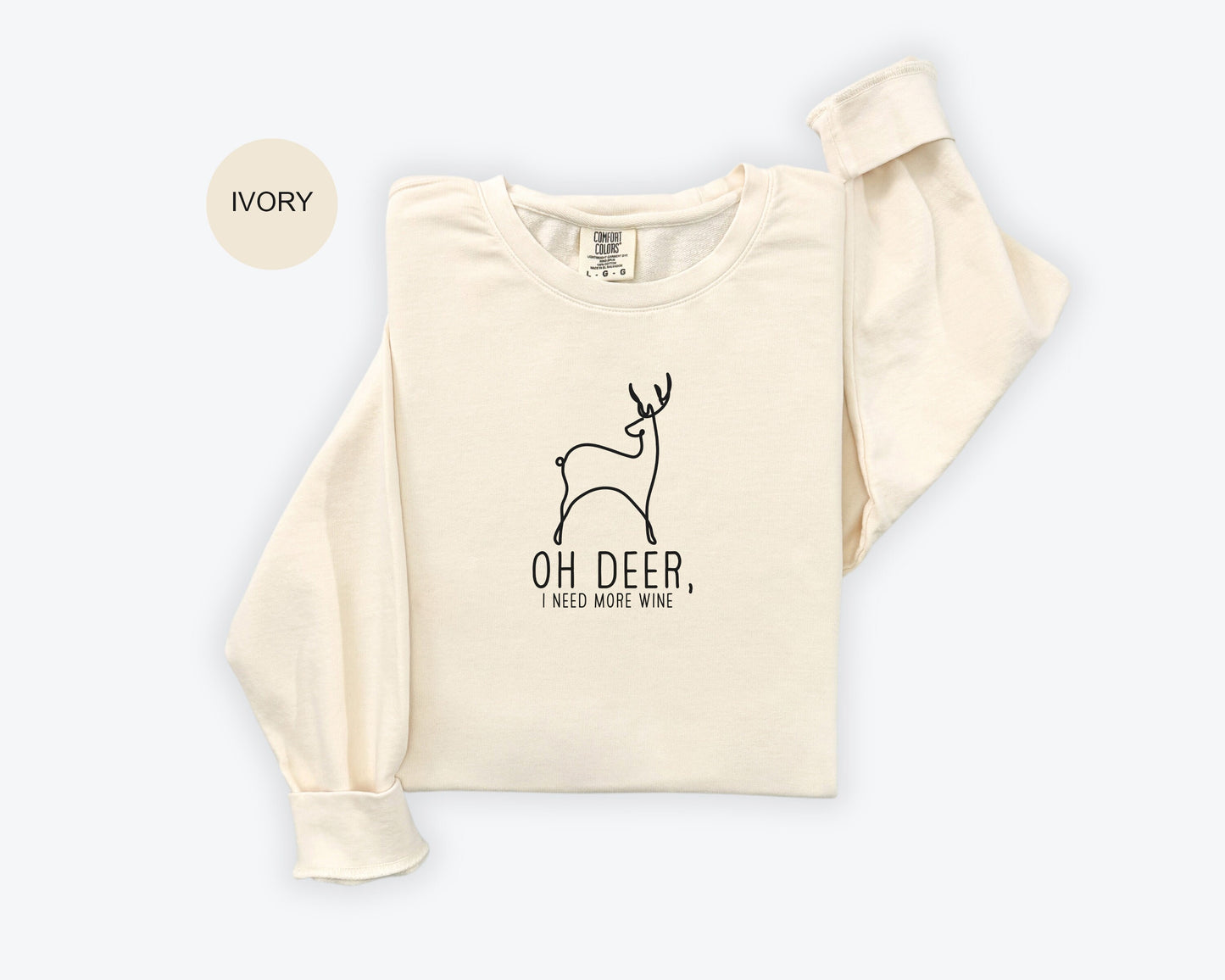 a white shirt with a deer on it