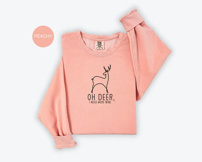 a pink shirt with a deer on it