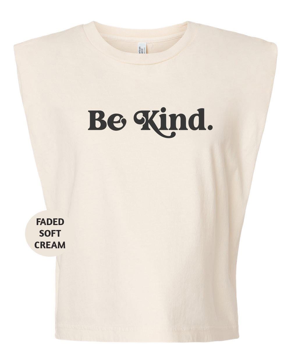 a white t - shirt with the words be kind printed on it