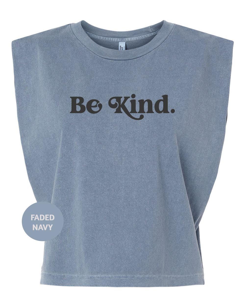 a t - shirt with the words be kind printed on it