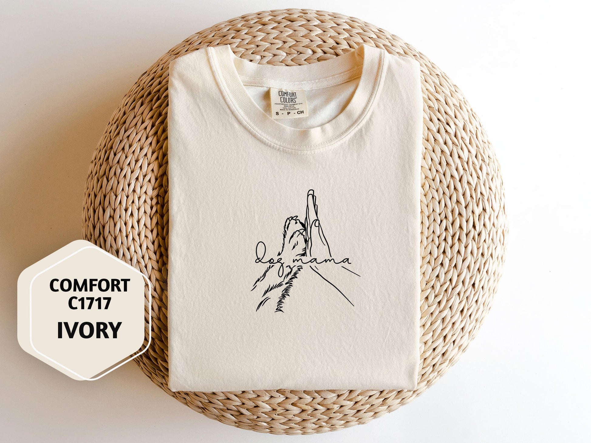 a white t - shirt with a drawing of a hand holding a knife