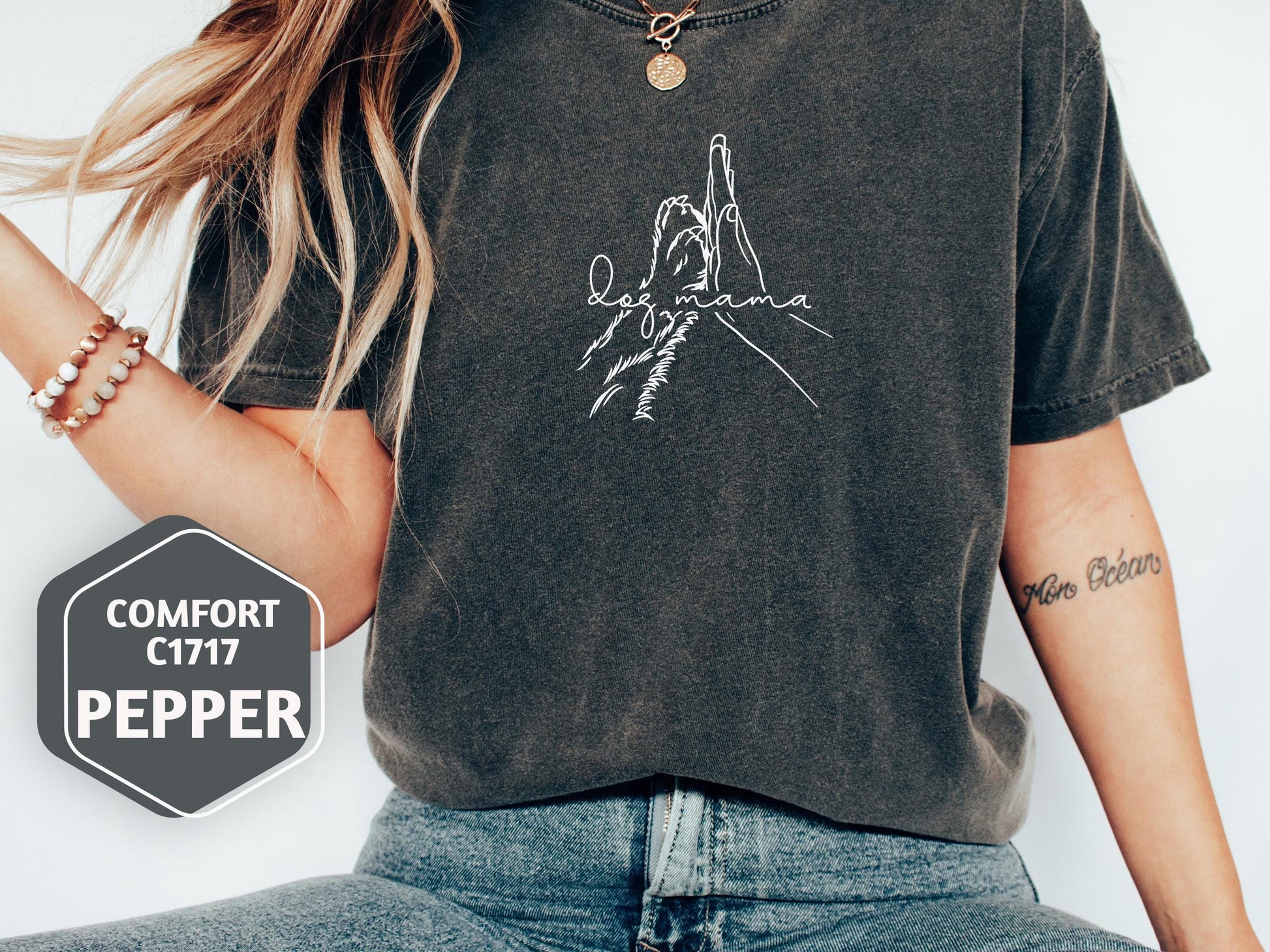 a woman wearing a black shirt with a picture of a person on it