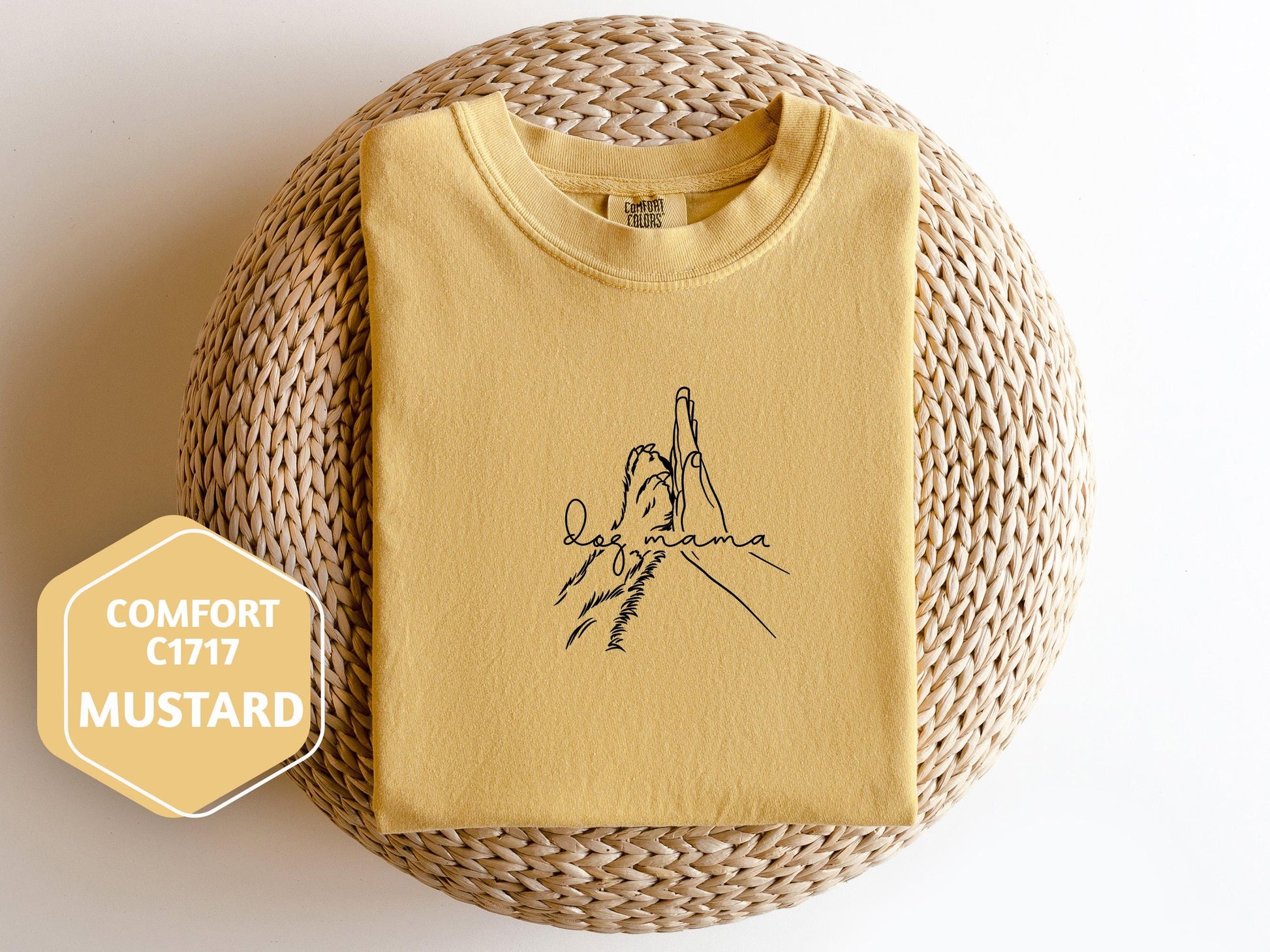 a yellow t - shirt with a picture of a hand on it
