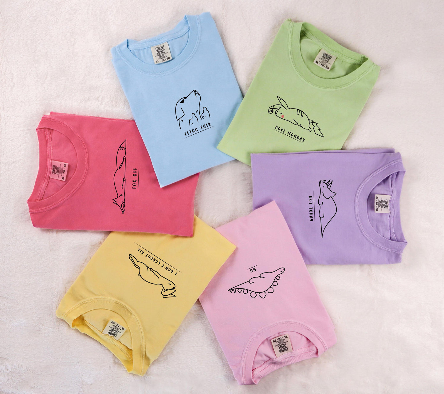 four different colored onesuits with a picture of a dog on them