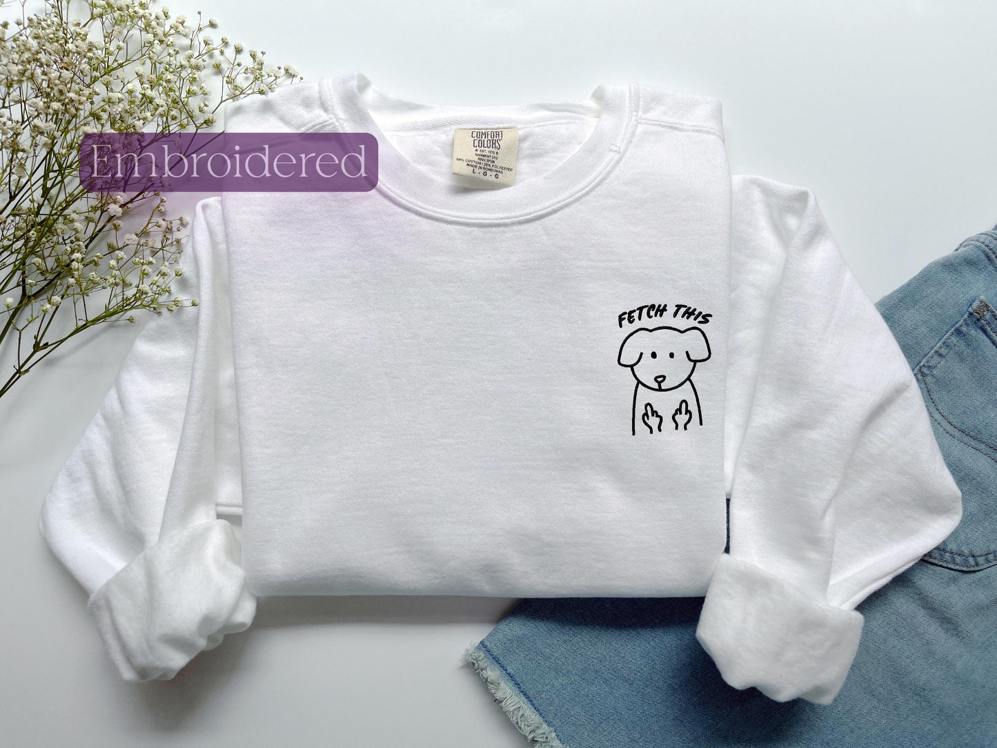 a white shirt with a dog drawn on it