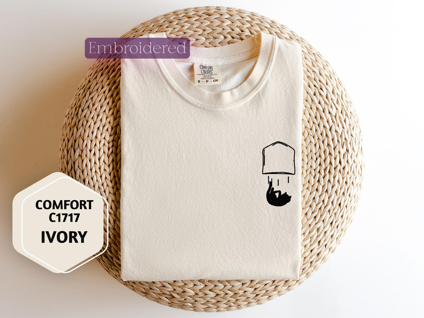 a white t - shirt with a picture of a lamp on it