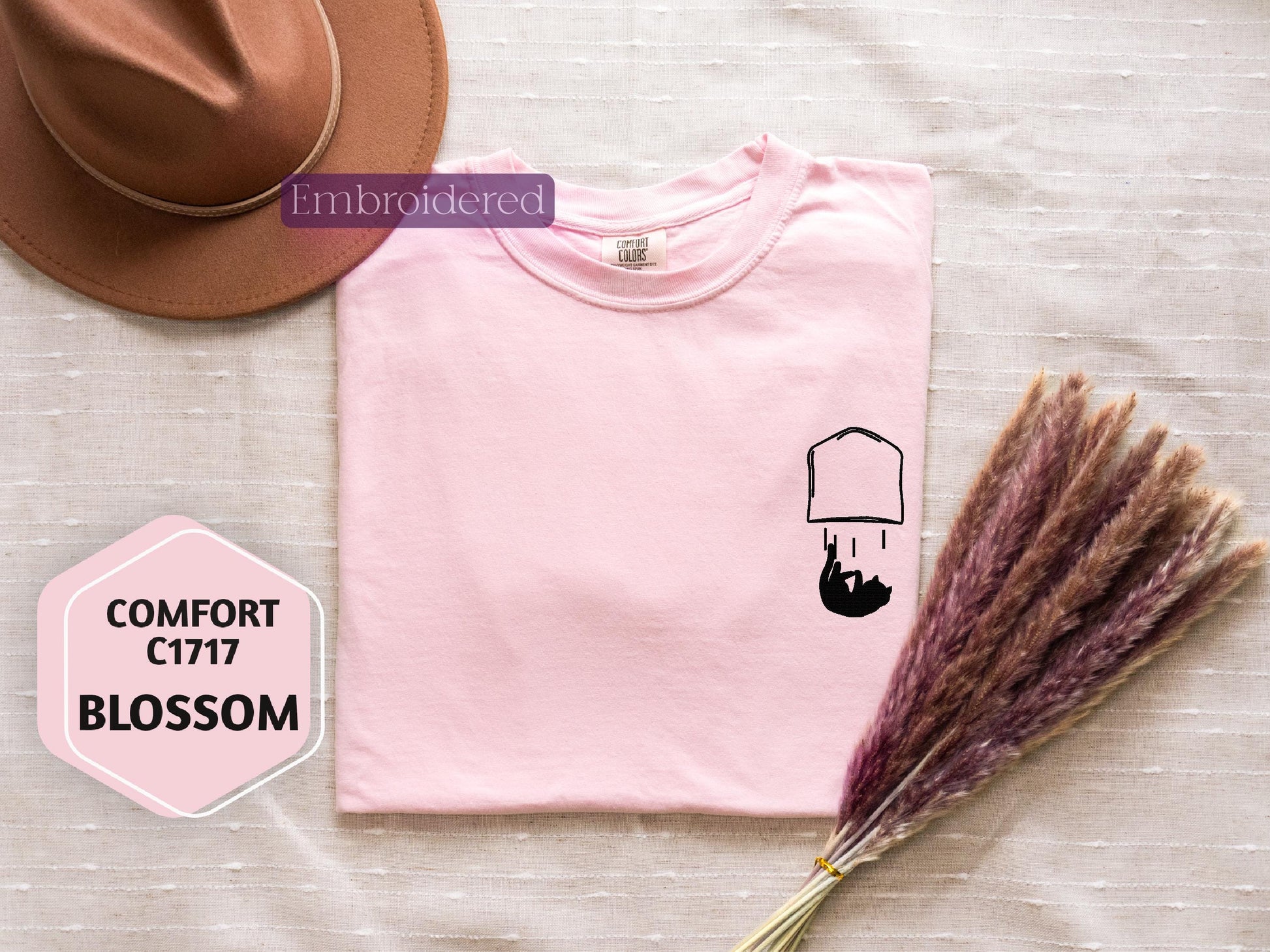 a pink t - shirt with a picture of a man's head on it