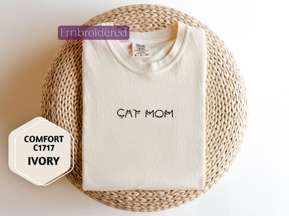 a t - shirt with the word cat mom written on it