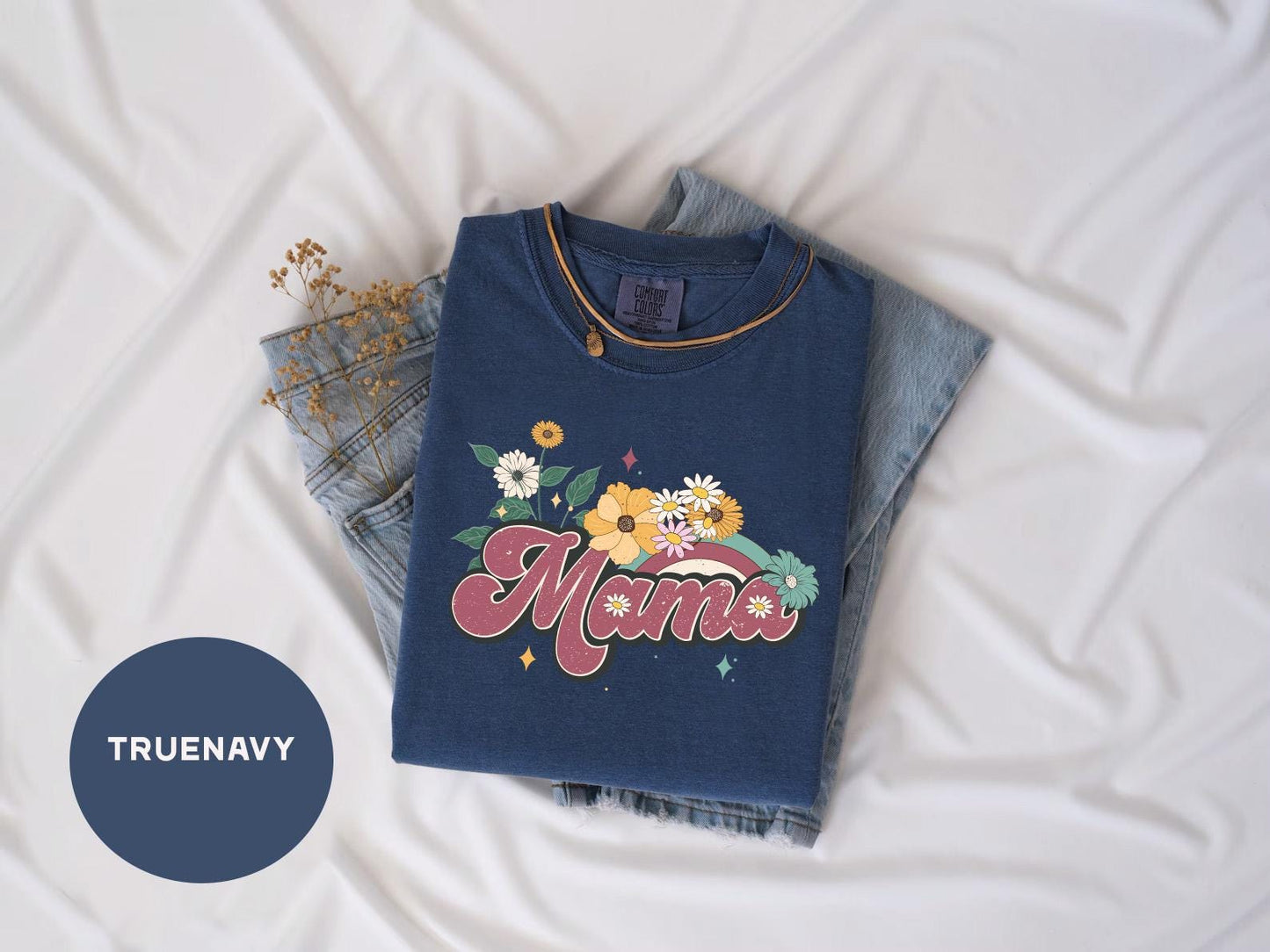 a blue t - shirt with the word mama written on it