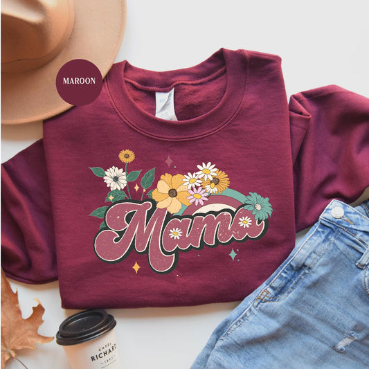 a maroon shirt that says mama with flowers on it