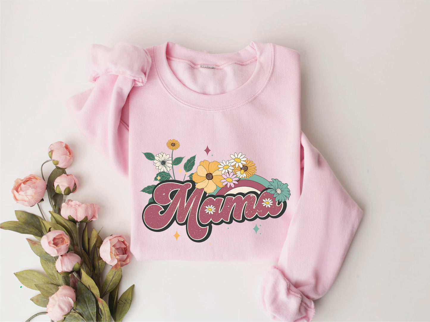 a pink sweatshirt with the word mama written on it