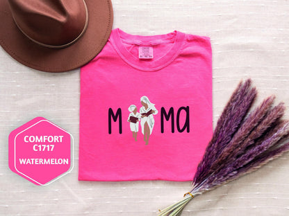 a pink shirt with a picture of a flower and a hat