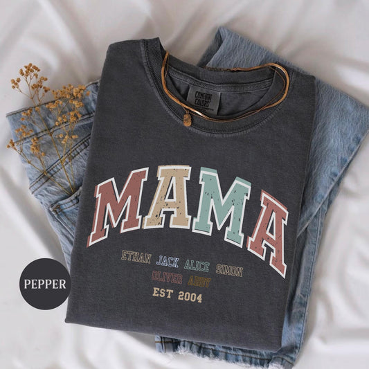 a pair of jeans and a t - shirt on a bed