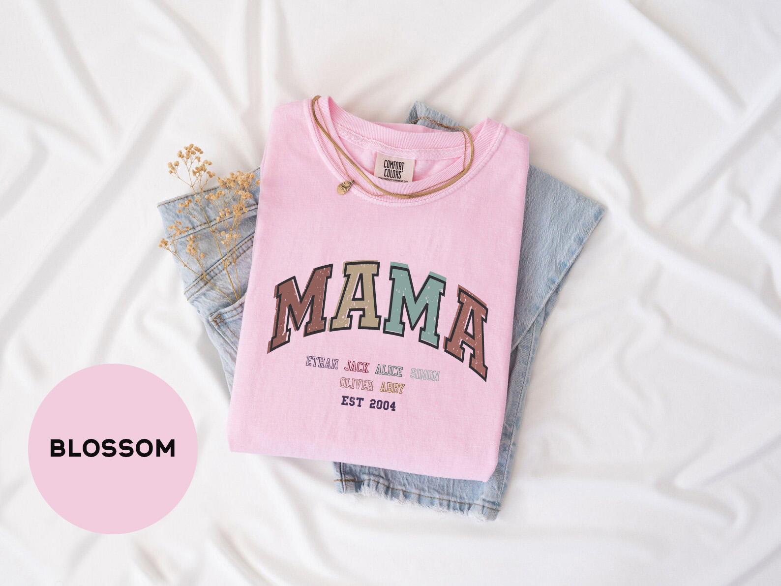 a pink shirt with the word mama printed on it