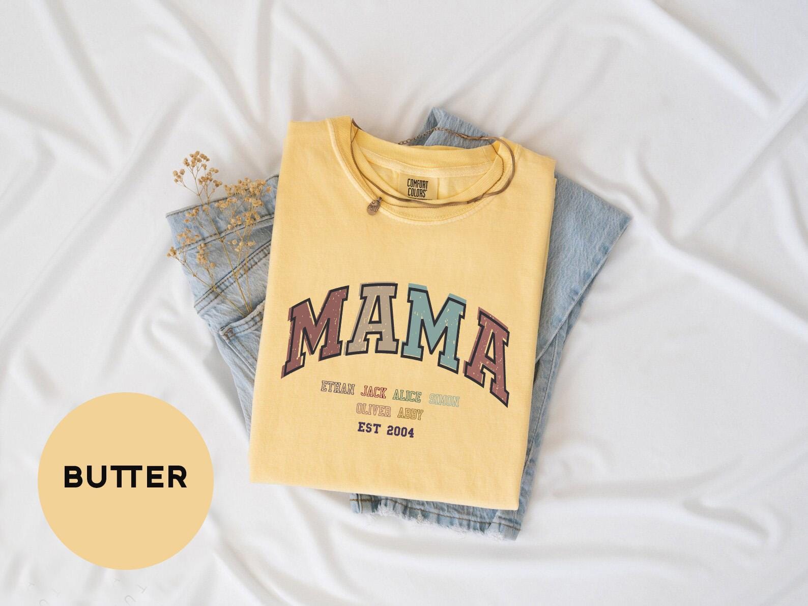 a yellow shirt with the word mama printed on it