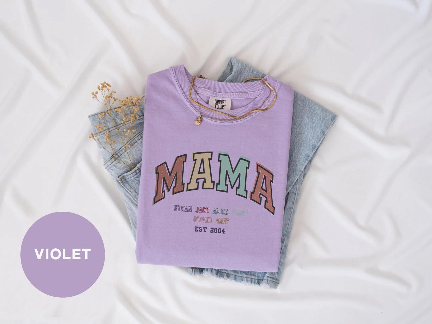 a purple shirt with the word mama printed on it