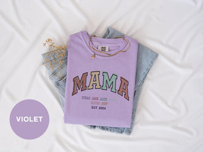 a purple shirt with the word mama printed on it