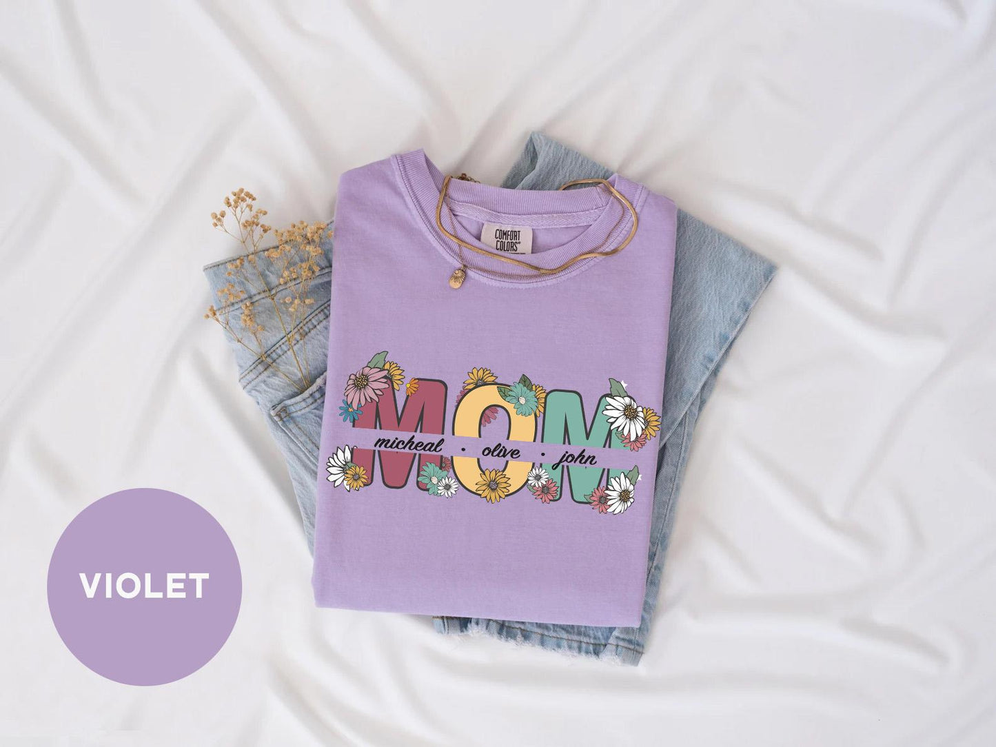 a purple shirt with the word mom on it
