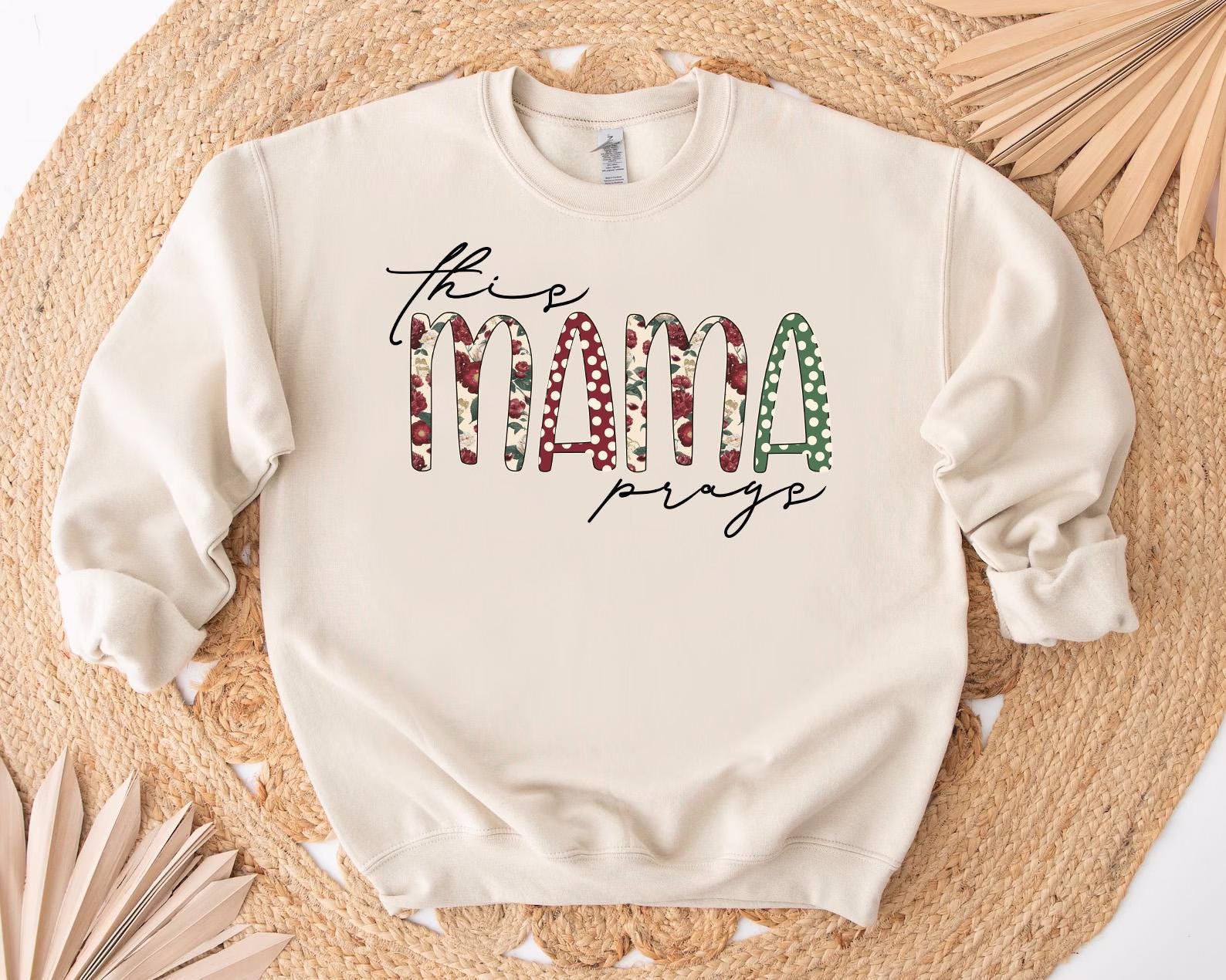 a white sweatshirt with the word mama printed on it