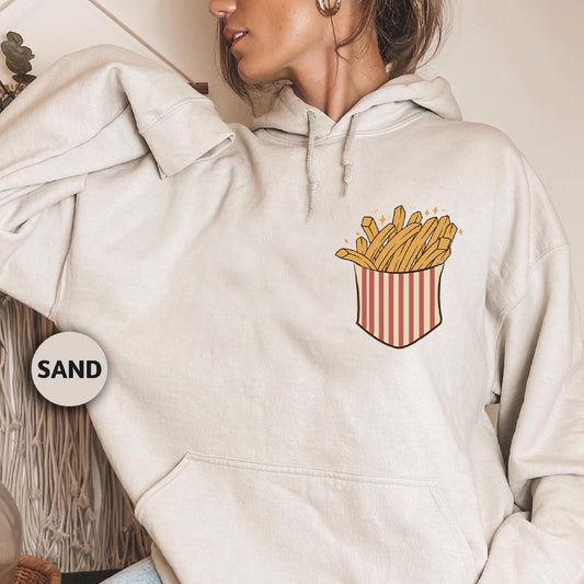 a woman wearing a white hoodie with a french fries pocket