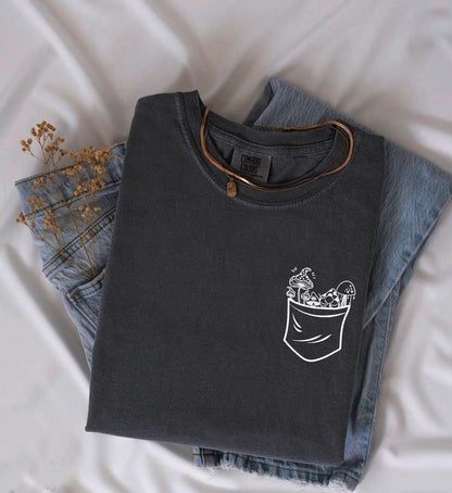 a pair of jeans and a t - shirt on a bed