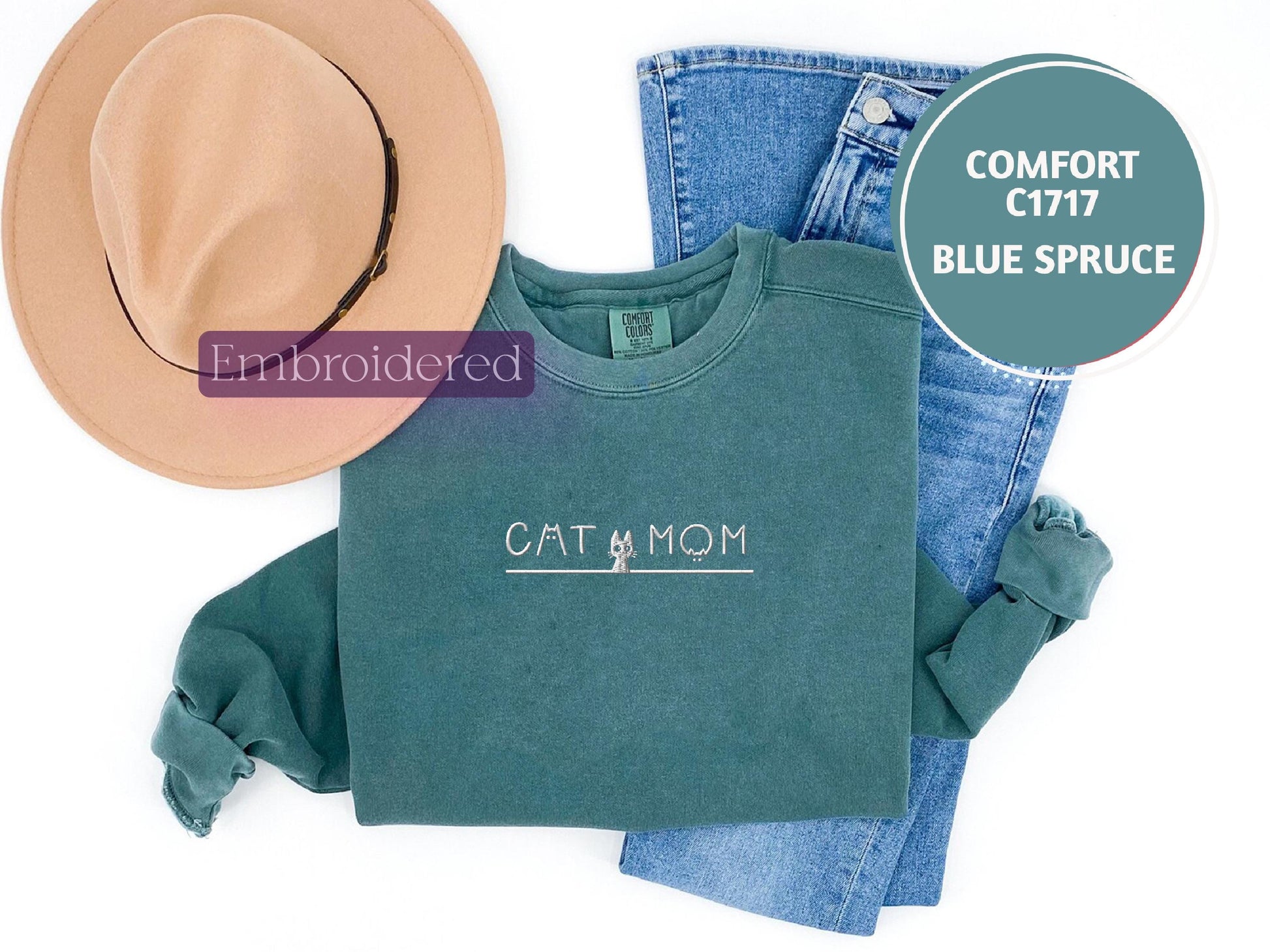 a pair of jeans, a hat, and a t - shirt on a white