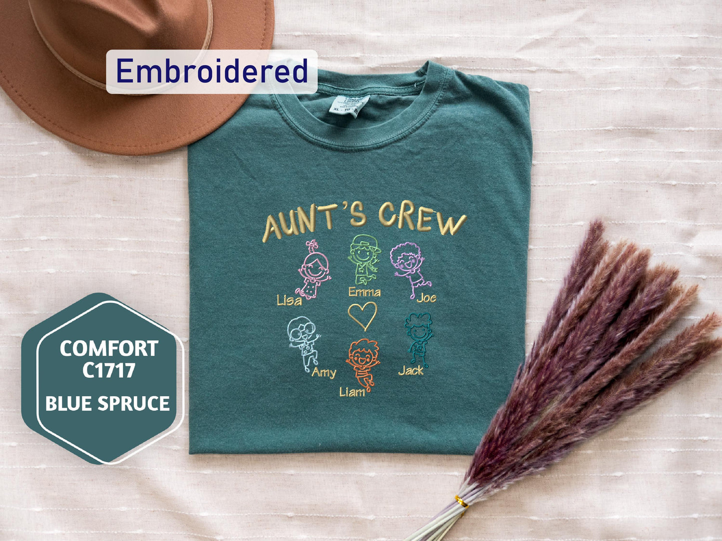 a t - shirt with the words, aunt's crew, and a straw