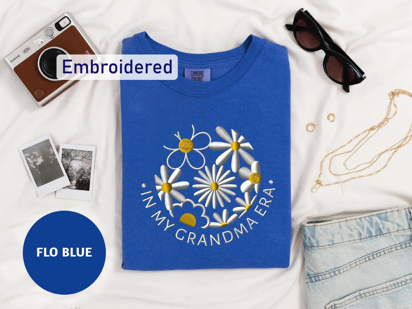 a t - shirt with a picture of a flower on it and a pair of