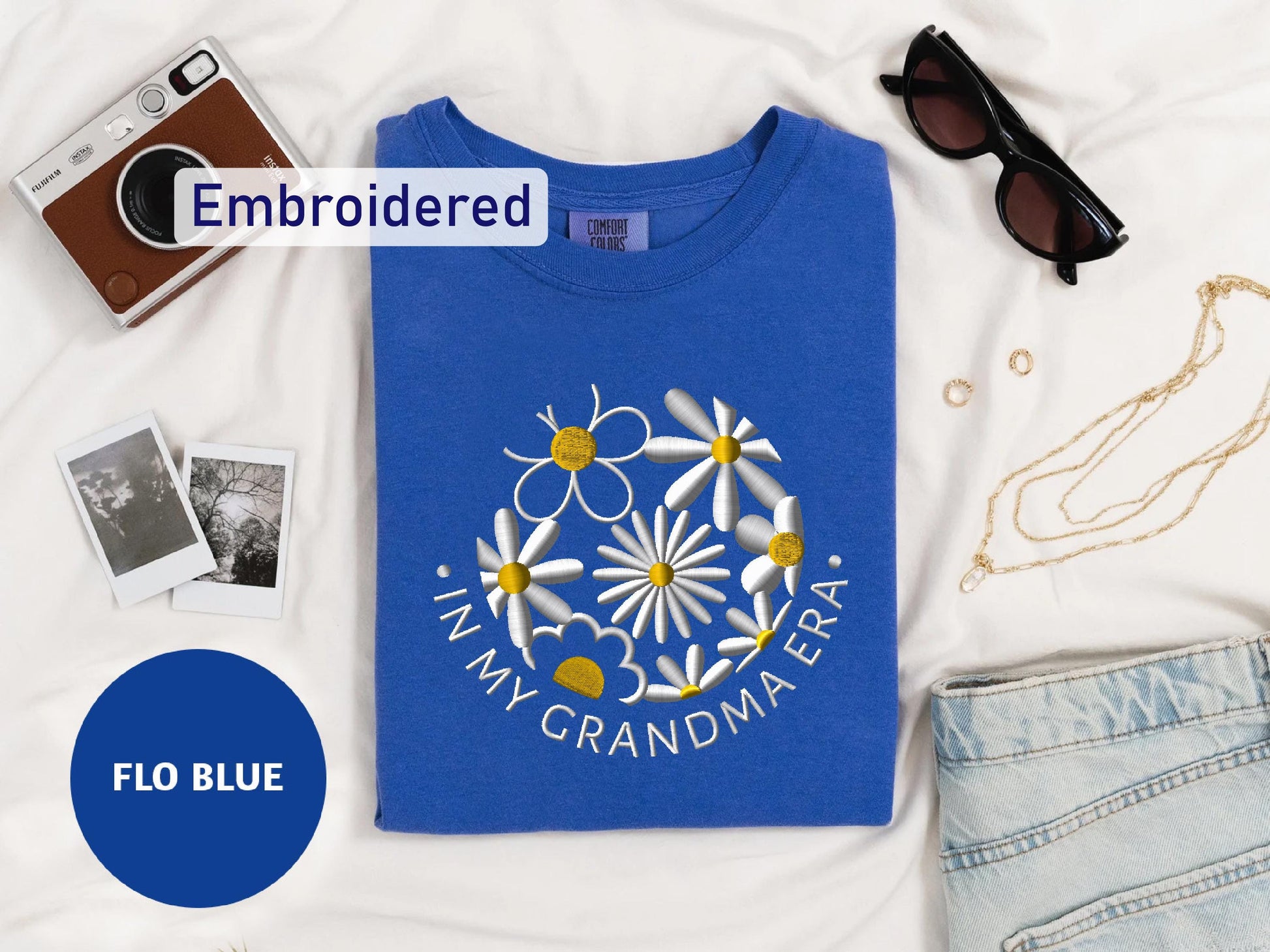 a t - shirt with a picture of a flower on it and a pair of