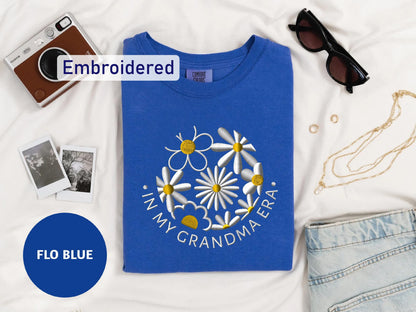 a t - shirt with a picture of a flower on it and a pair of