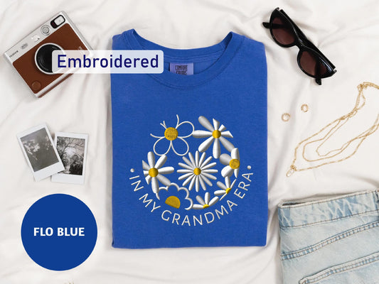 a t - shirt with a picture of a flower on it and a pair of