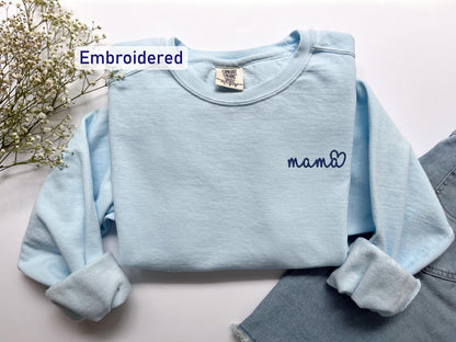 a blue sweater with the word mama written on it