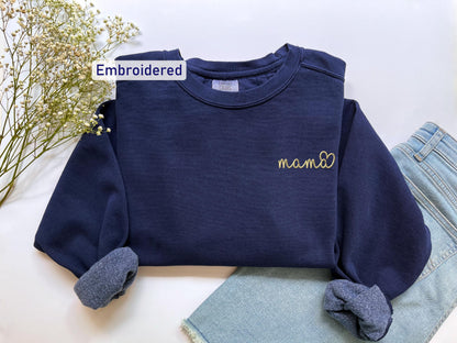 a blue shirt with a name on it and a pair of jeans