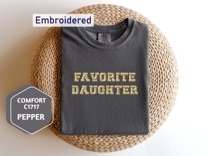 a t - shirt with the words favorite daughter on it