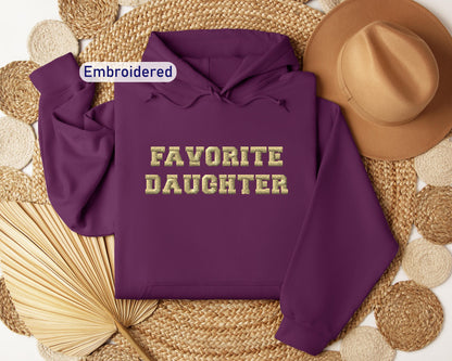 a purple hoodie with the words favorite daughter on it