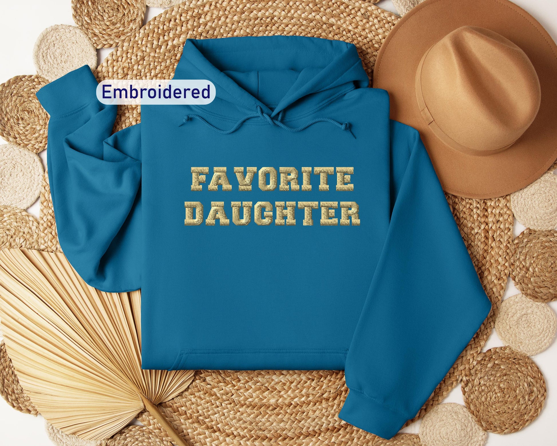 a blue hoodie with the words favorite daughter on it