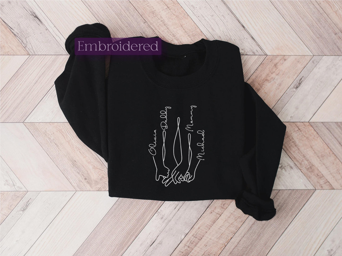 a black shirt with a skeleton hand drawn on it