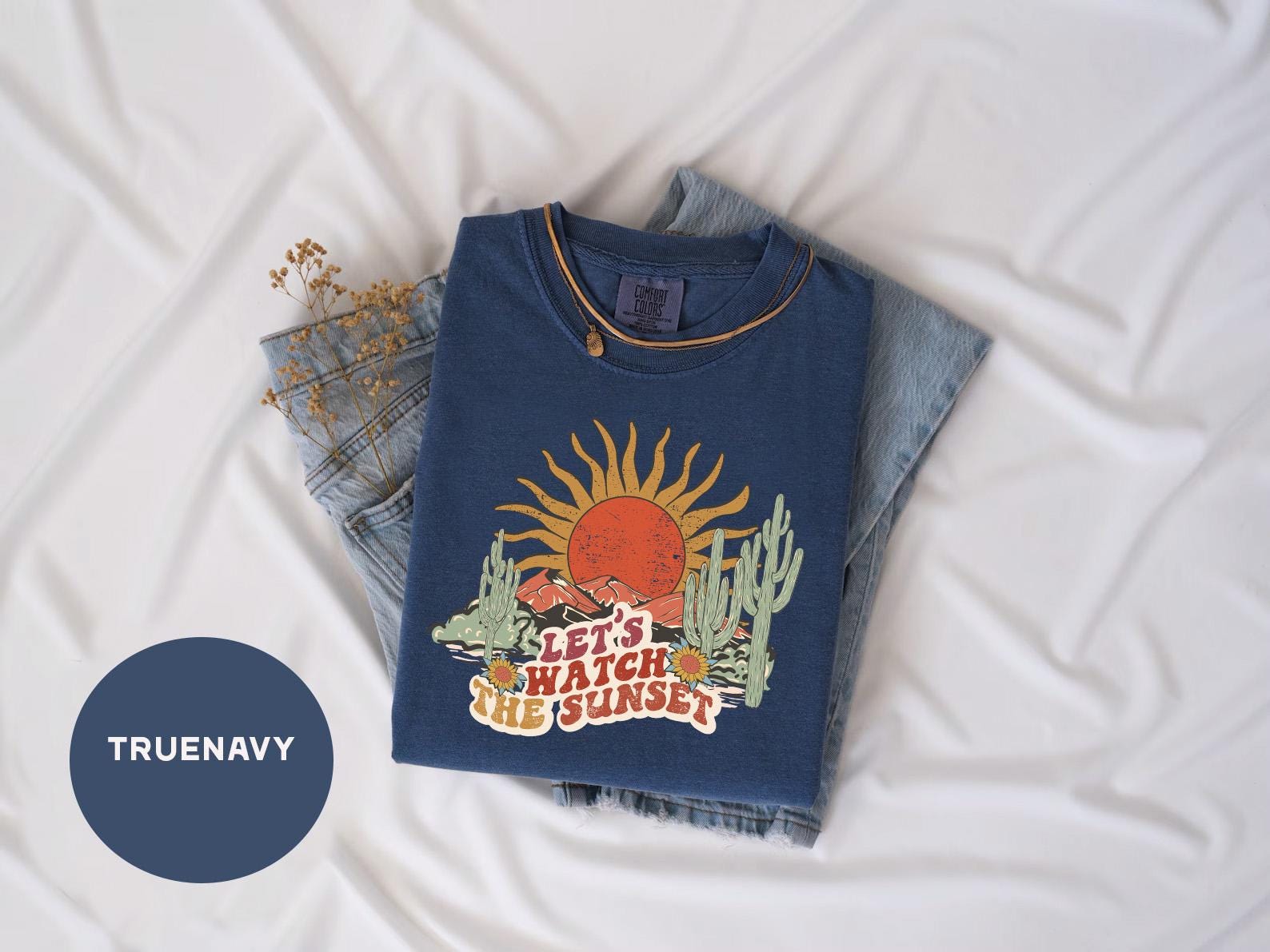 a t - shirt with a picture of a sun on it