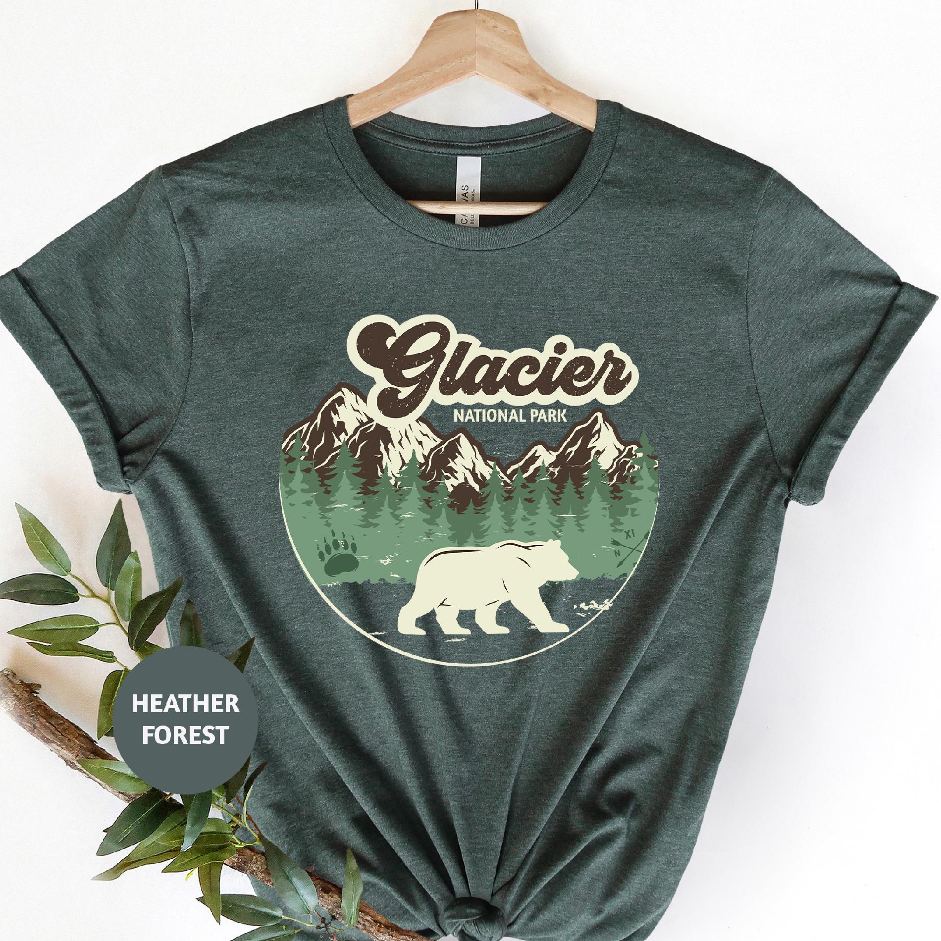 a t - shirt with a bear and mountains on it