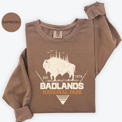 a brown shirt with an image of a bison and the words badlands national park