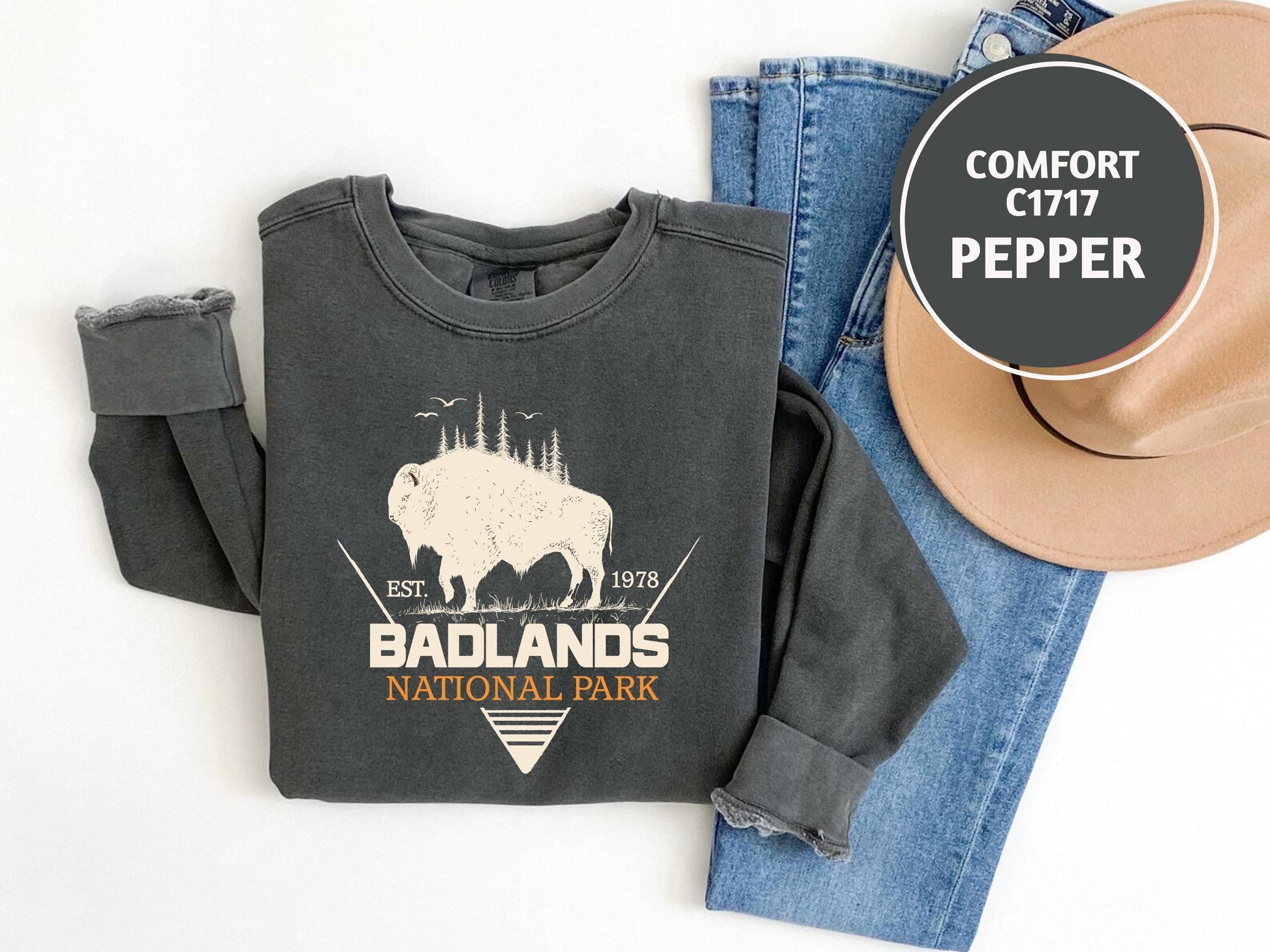 a pair of jeans and a t - shirt with a buffalo on it