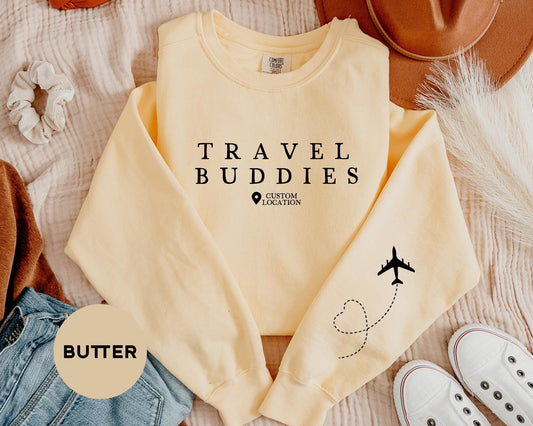 a sweater that says travel buddies on it