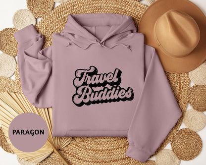 a pink hoodie with the words travel buddies on it