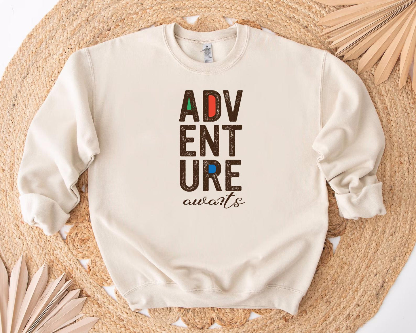 a white sweatshirt with the words adventure on it