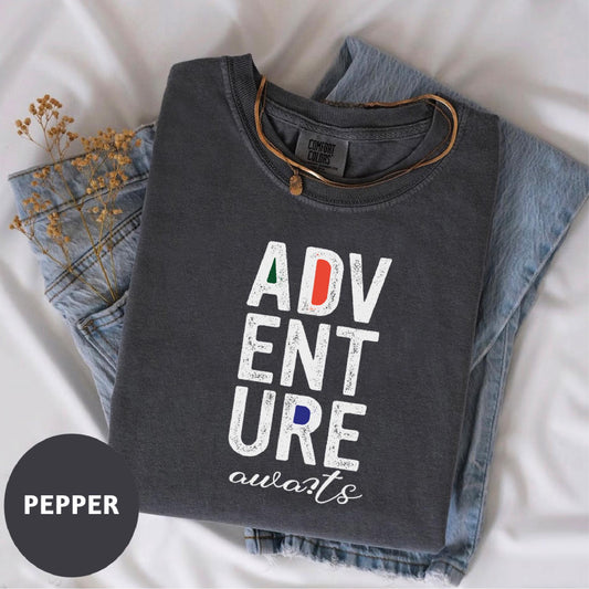 a t - shirt that says adv ent sure awaits next to a