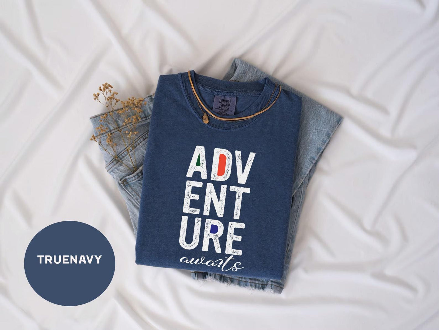 a t - shirt that says adv ent sure is next to a pair