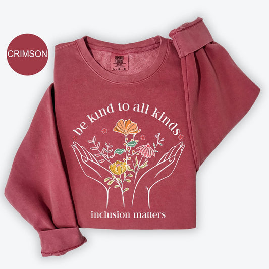 a red shirt with a picture of two hands holding flowers